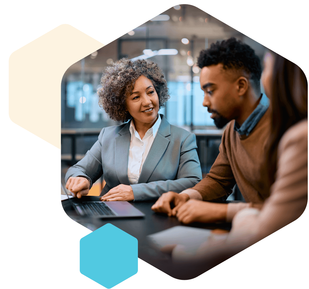 financial advisor with a couple right@2x